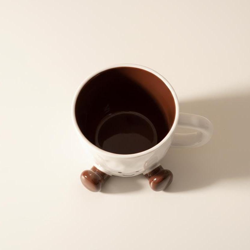 Smiley Face Ceramic Mug with Dangling Feet • Cozy Coffee Cup