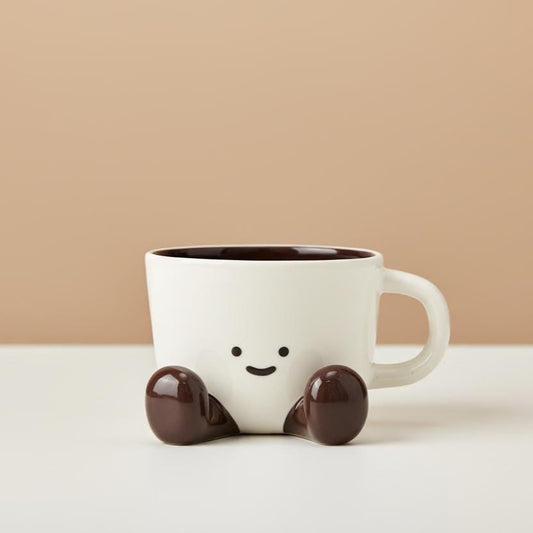 Smiley Face Ceramic Mug with Dangling Feet • Cozy Coffee Cup